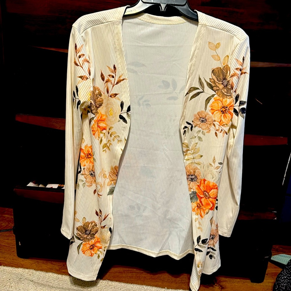 Lightweight, long-sleeved cream cardigan with peach/tan/brown flowers
